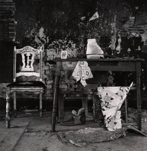 [Interior with chair, table, and card]
