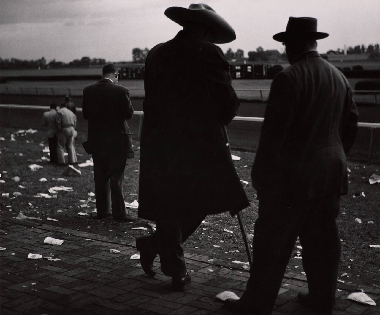 [Men at race track]