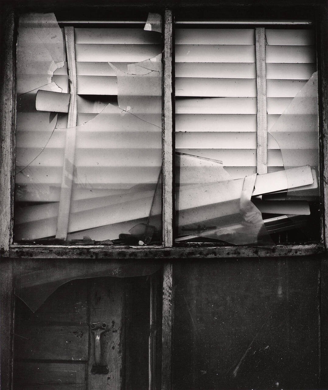 [Broken window and damaged blinds]