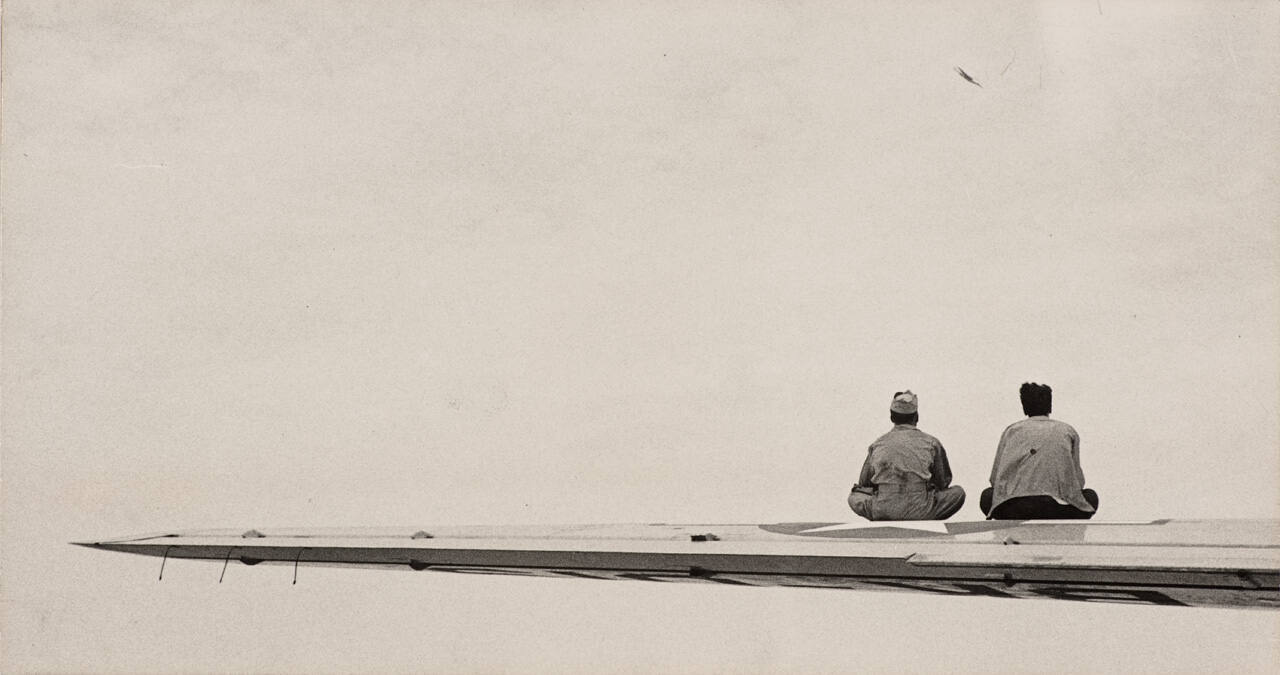 Untitled (Men Sitting on Airplane Wing)