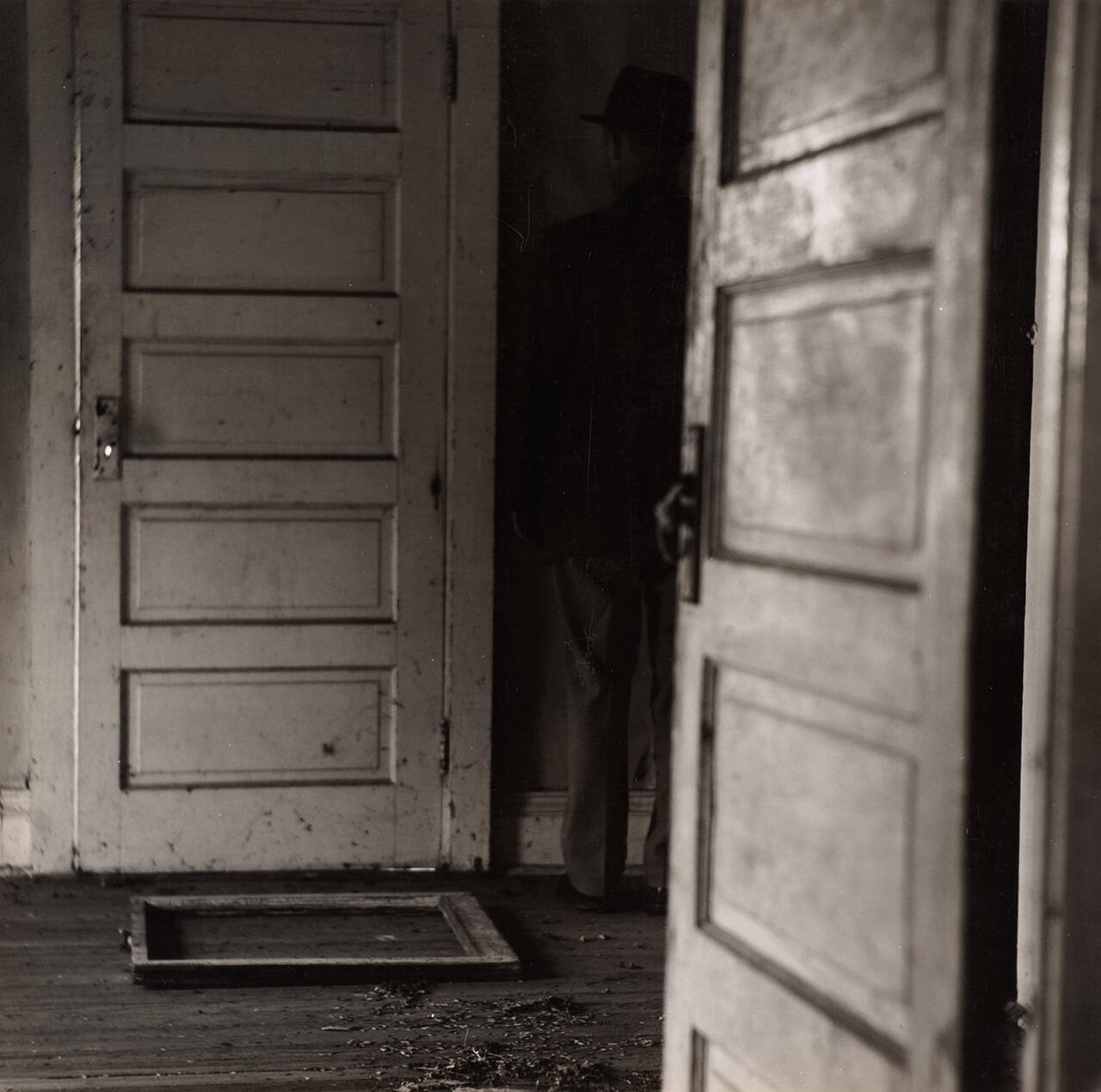 [Man between two doors]
