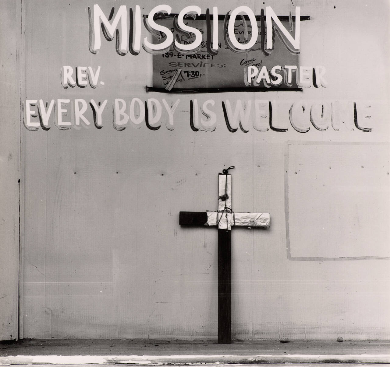 [Cross in window]