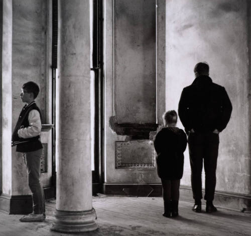 [Three figures in interior]