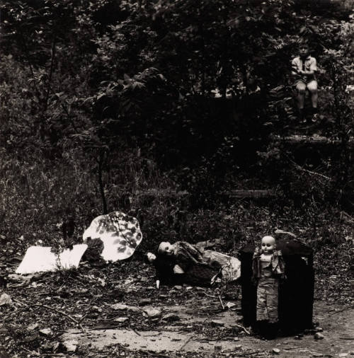 [Boy and dolls outside]