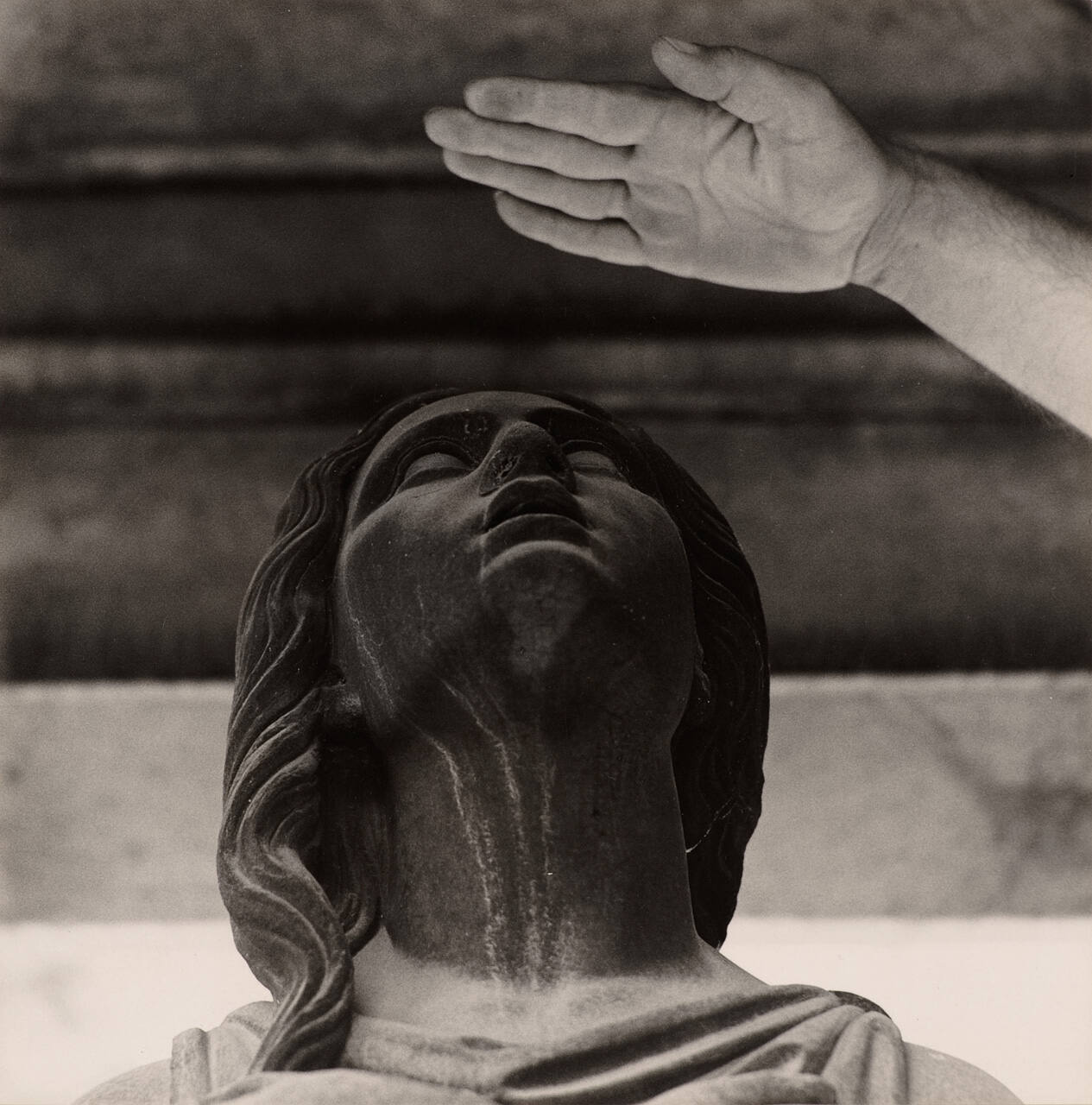 [Cemetery statue and hand]