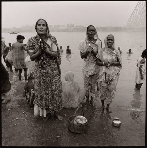 Calcutta, India (Women Praying with Candles at the Ganges)