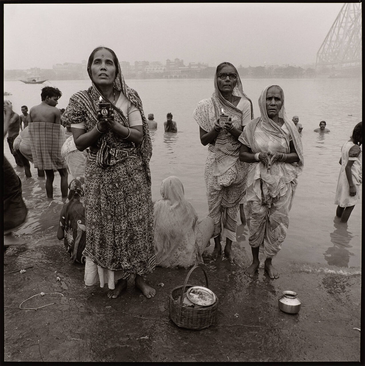 Calcutta, India (Women Praying with Candles at the Ganges)