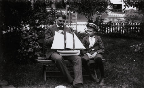 Connecticut or N.Y. State, Man and Boy with toy sailboat
