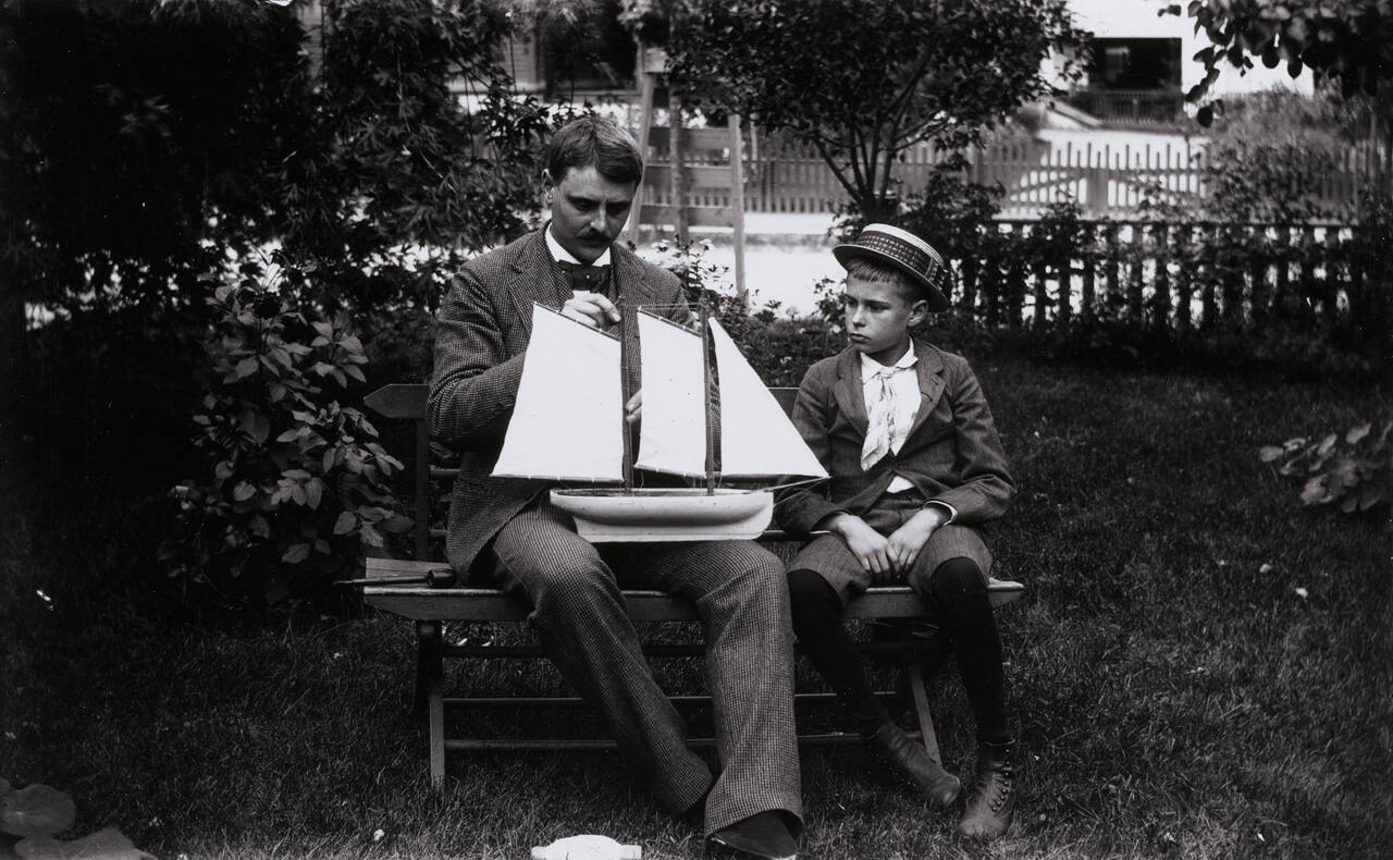 Connecticut or N.Y. State, Man and Boy with toy sailboat