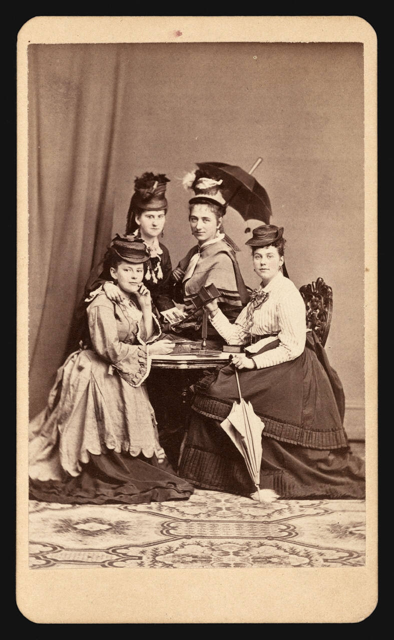 Group of women looking at stereographs
