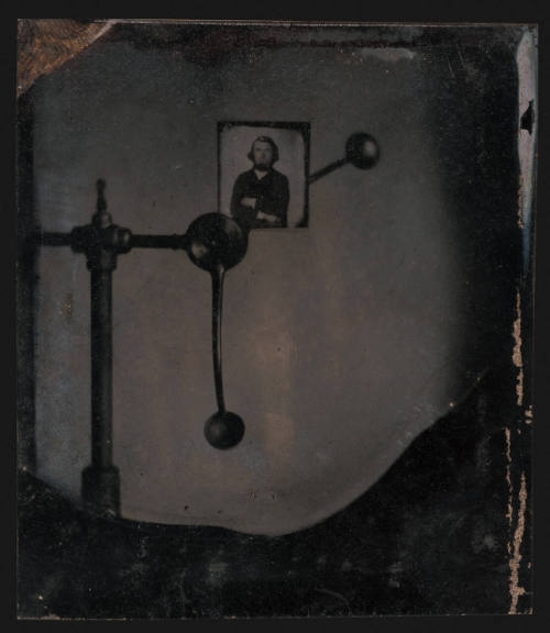 Head clamp holding portrait of a man