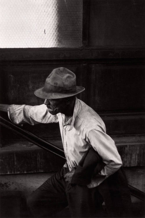 Man coming up subway stairs