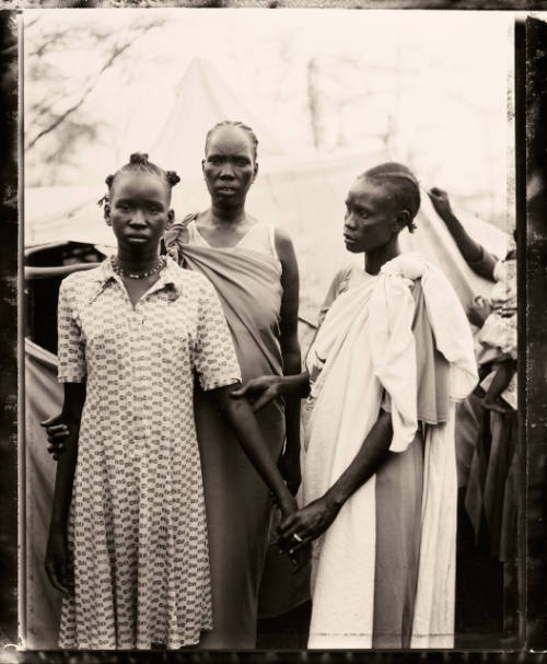 Akout Nyibol (Pregnant @ Center) with Riak Warabek & Akout's Daughter