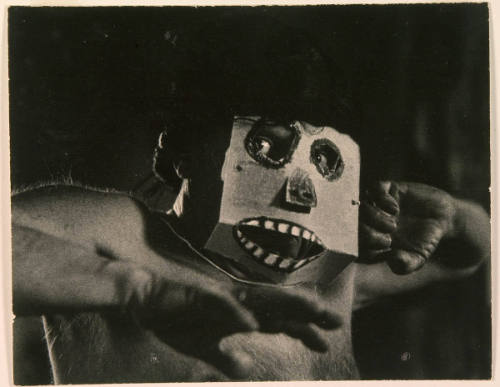 Picasso Wearing Cardboard Mask
