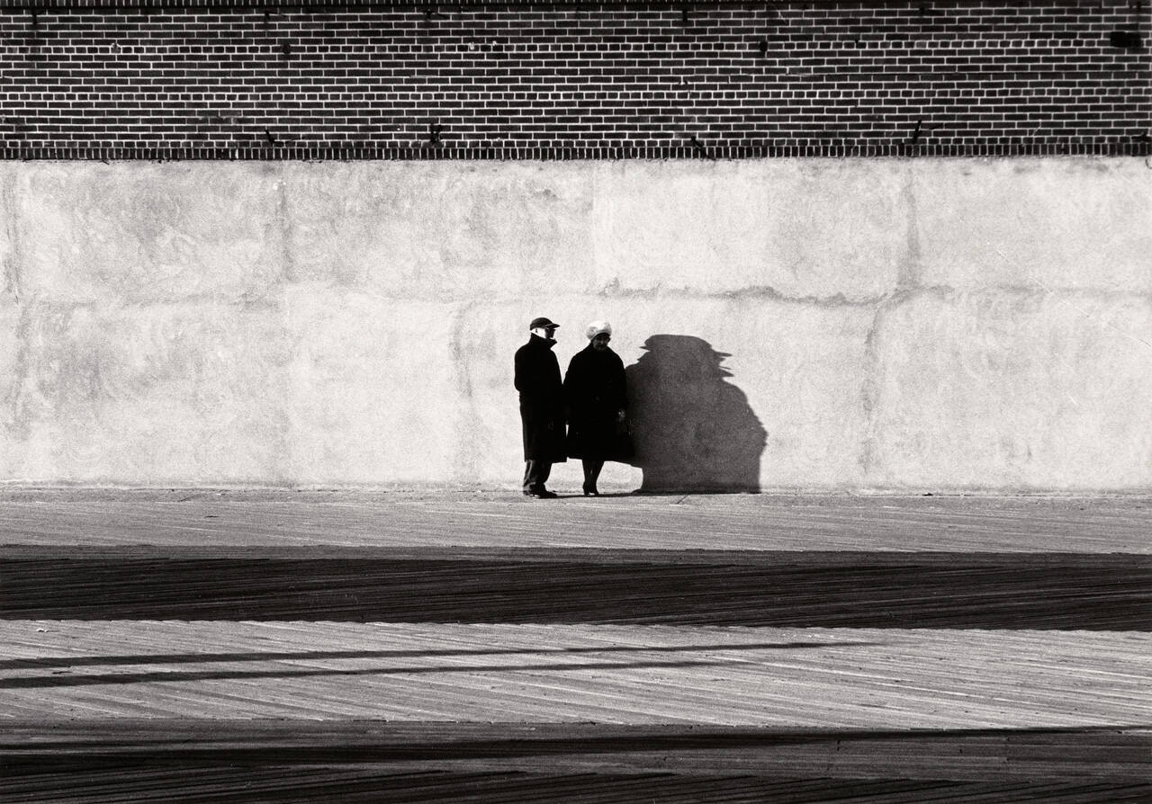 Man and woman with shadows, Coney Island, New York