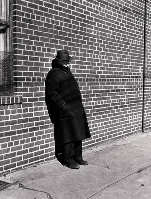 Man Standing Against Brick Wall, Brooklyn, NY