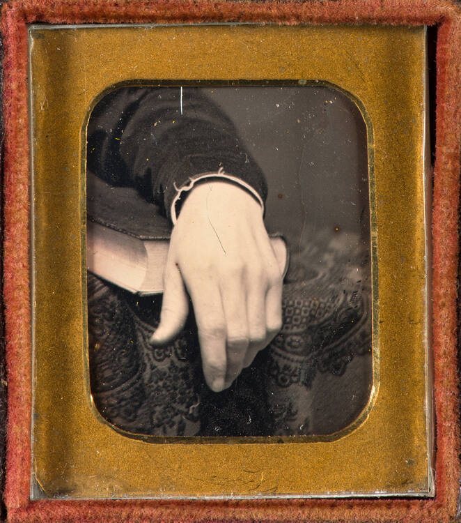 Hand on book