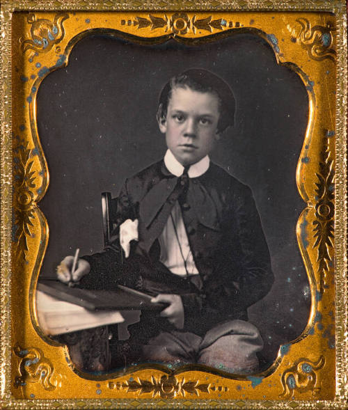 Boy with writing board