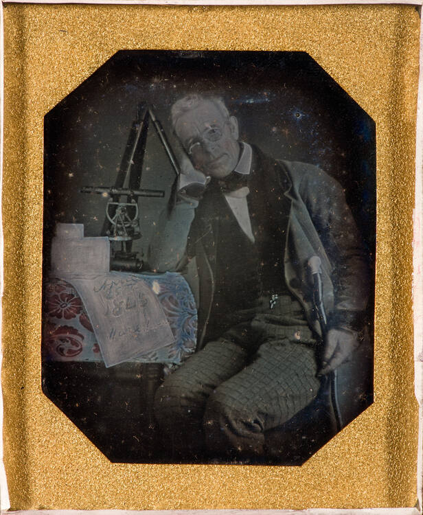 Surveyor with Instruments and Documents