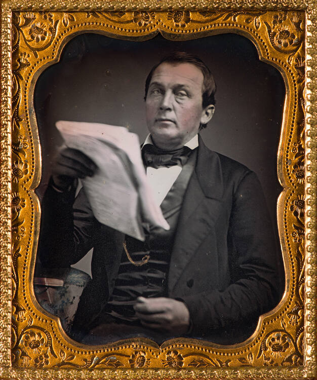 Man reading newspaper