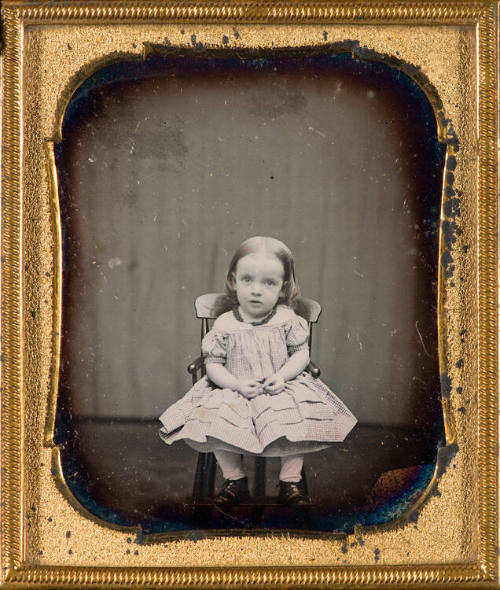 Portrait of small girl [with hair samples]