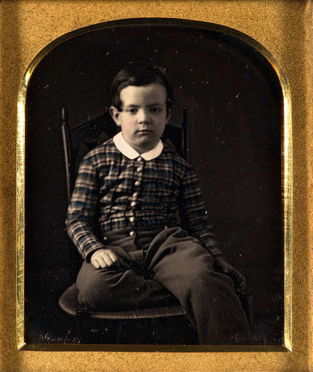 Portrait of seated boy
