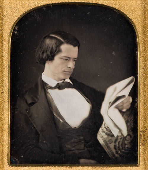 Man Reading Newspaper