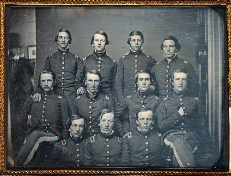 Uniformed officers in studio with photographer