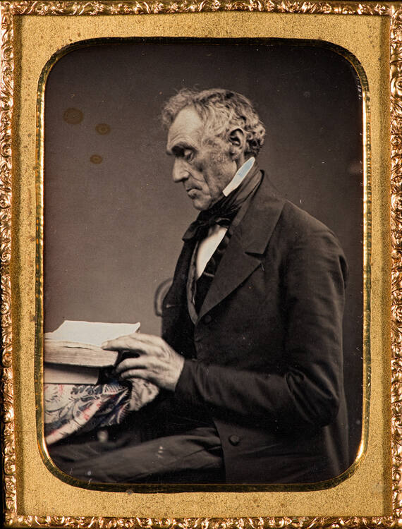 Man in profile, reading