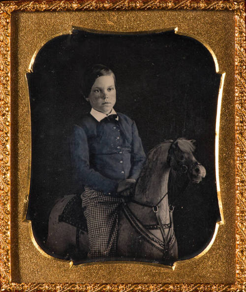 Boy on hobby horse