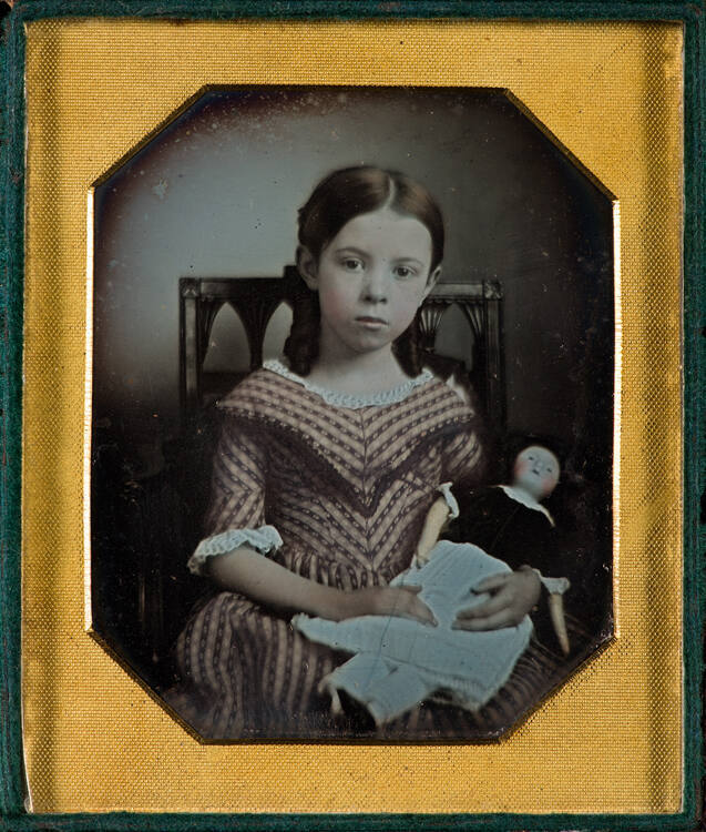 Child with doll