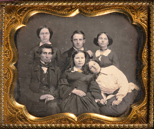 Group portrait with leaning woman