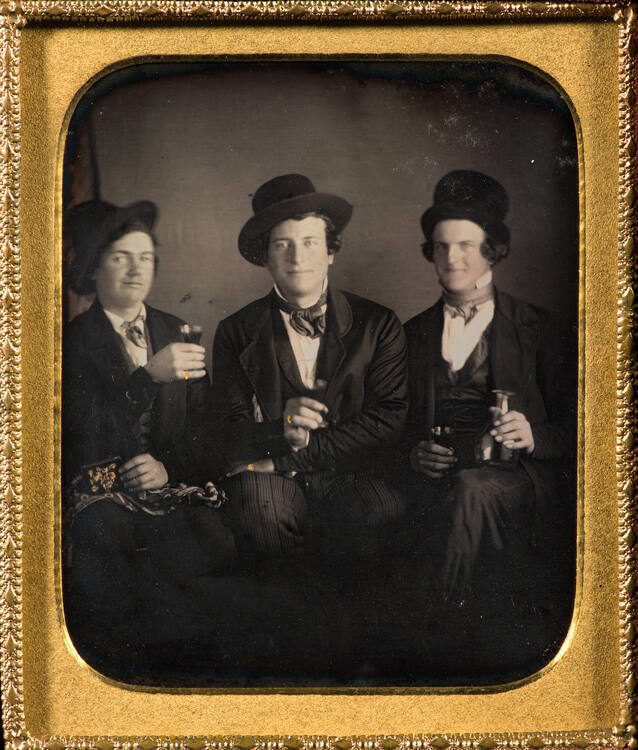Three men, toasting with wine glasses