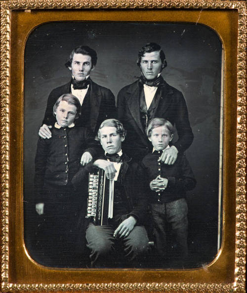 Five boys with accordion