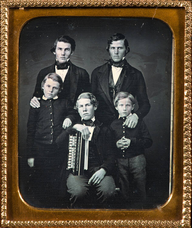 Five boys with accordion