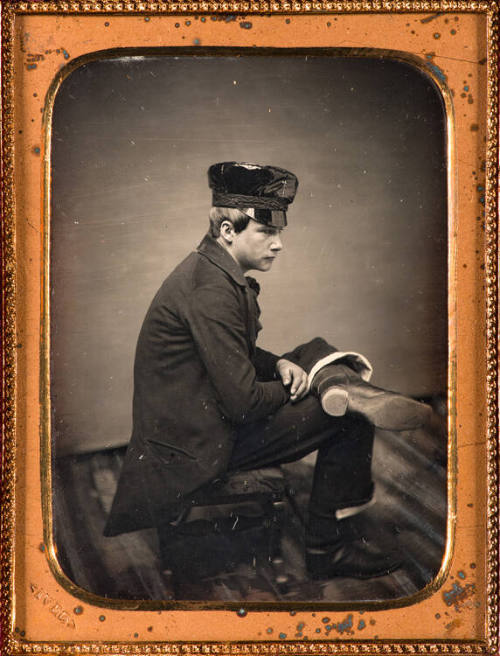 Seated man in casual profile pose