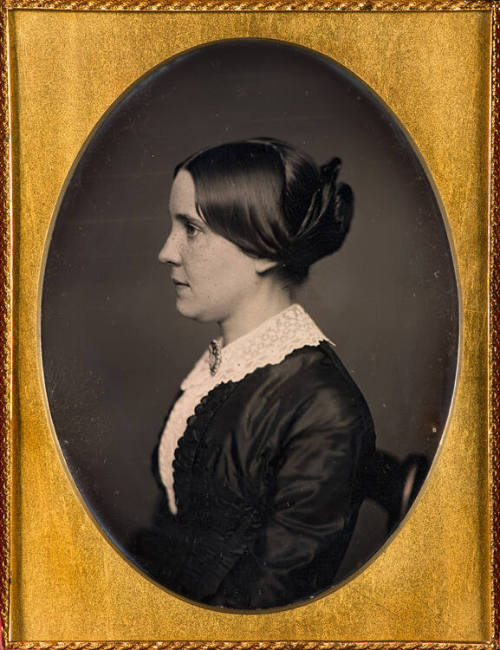 Freckled woman in profile