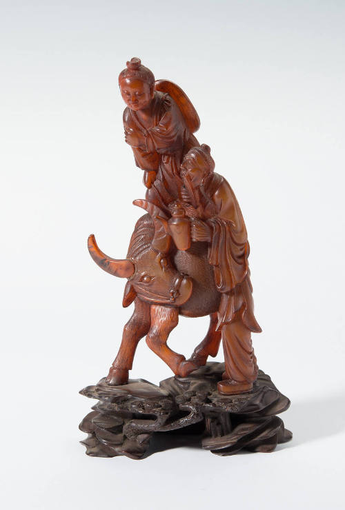 Old Man and Boy on Water Buffalo