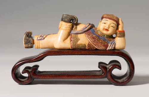 Female figure with stand