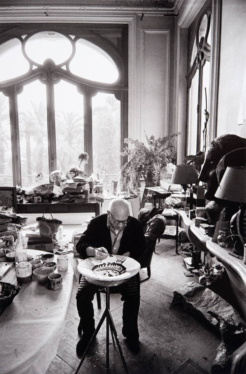 Pablo Picasso painting ceramics in the dining room, Cannes