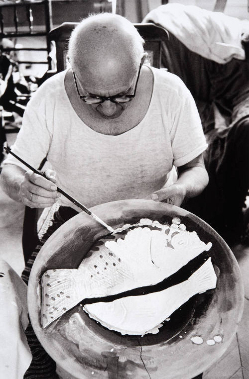 Picasso at work on another plate