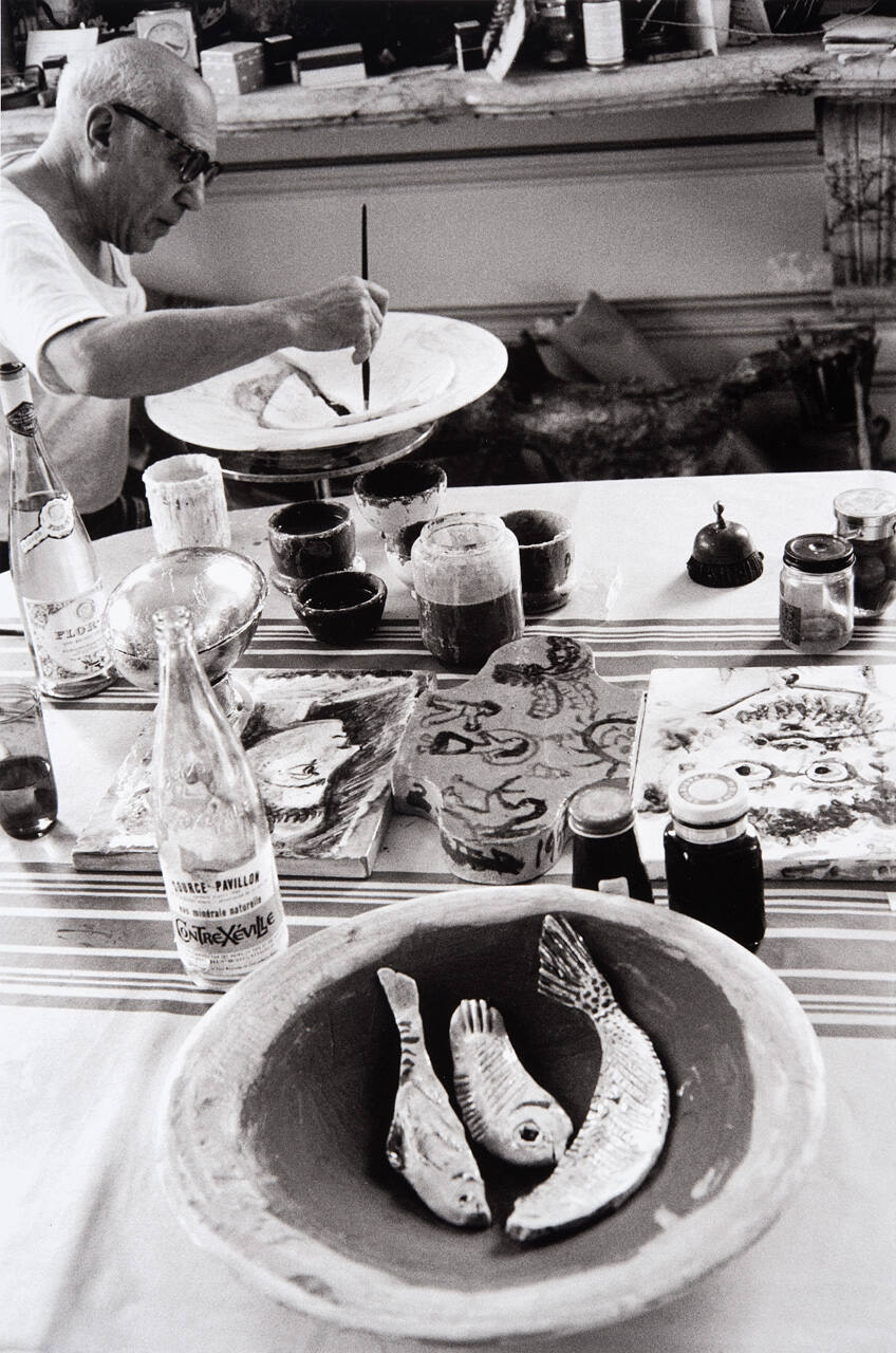 Picasso at work on another plate