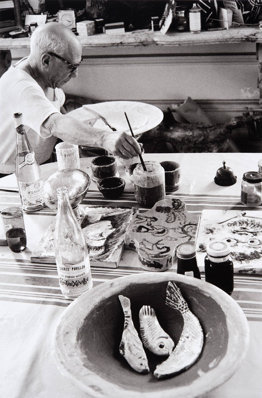 Picasso at work on another plate