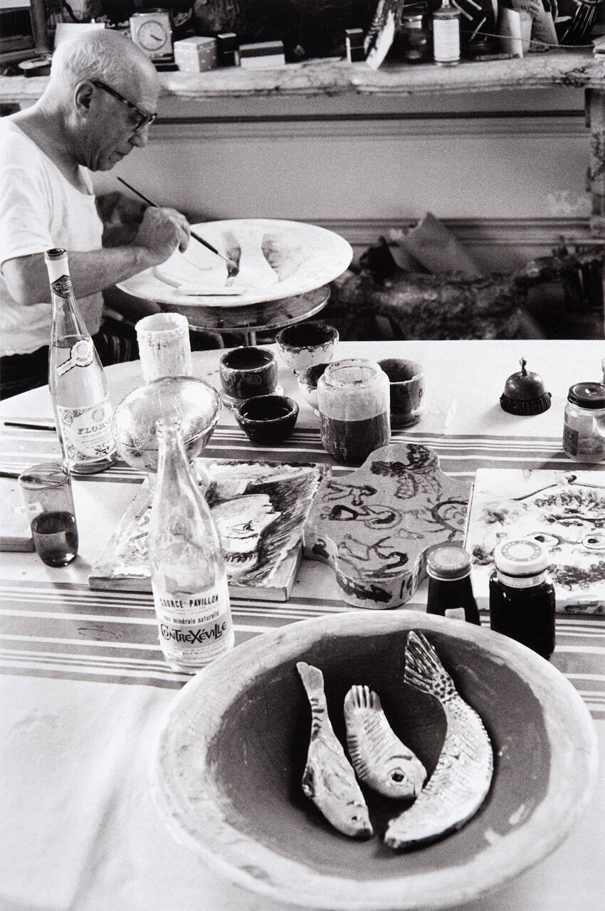 Picasso at work on another plate