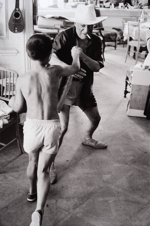 Claude and Paloma take over La Californie, wearing Picasso's masks, looking at Cooper's Stetson, clowning, boxing with the 75-year-old Maestro. Studio became a gymnasium and theater.
