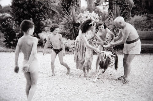 Claude, Paloma, Jacqueline, her daughter Kathy, and baby Meurice- son of the gateman-gardener- staging a private rodeo in the backyard, where Pablo tries to teach them how to ride a nanny goat