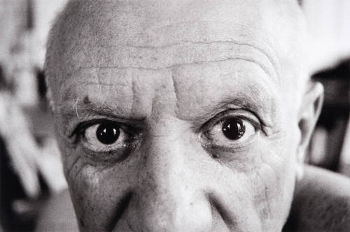 Extreme close-up of Pablo Picasso's eyes. La Californie's windows are seen clearly reflected.