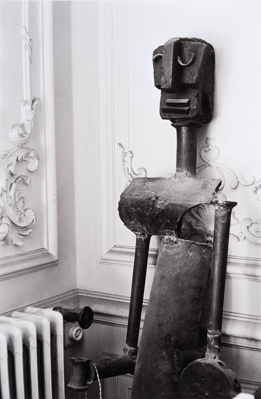 Sculpture leaning against wall