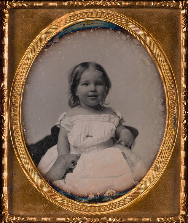 Child held by mother