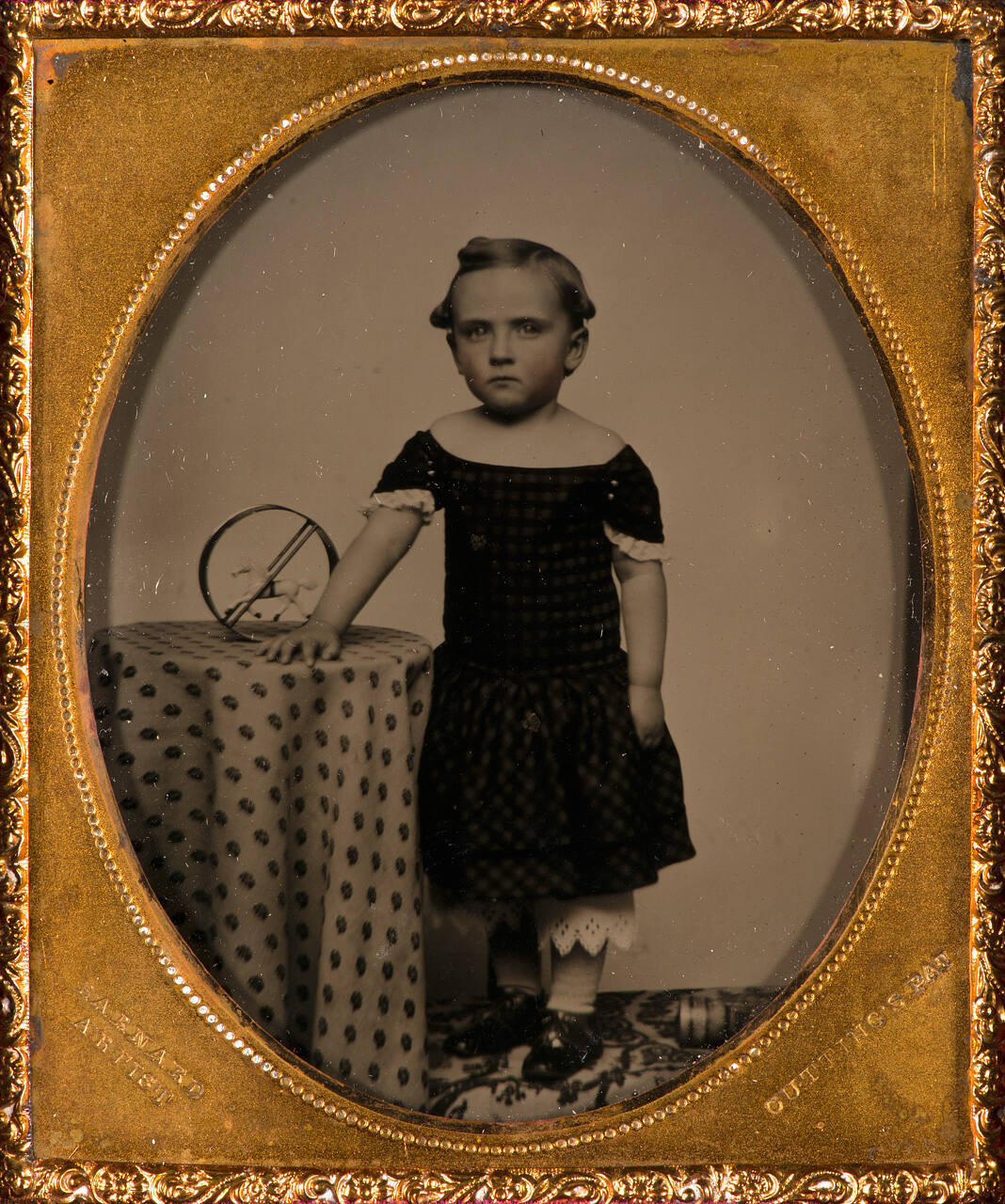 Young girl with toy horse